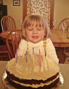 Bridget helped make the cake and place the candles.